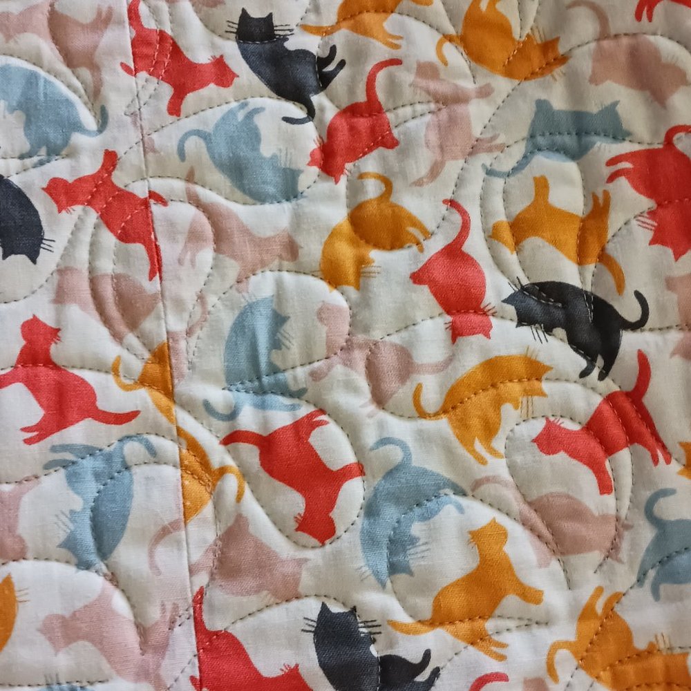 Quilt, measuring 60" by 44"